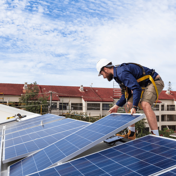 man fitting solar